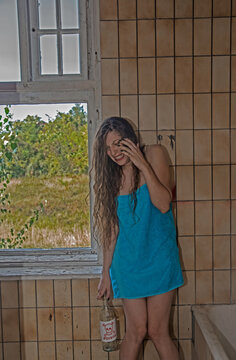 Disappointed Hysterical Young Woman Screaming and Holding a Bottle of Poison