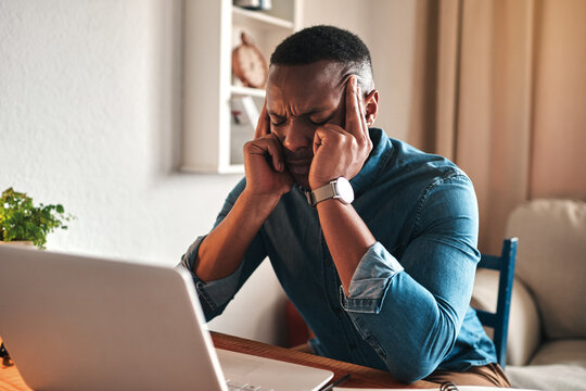 Stress, Pain And Headache While Working Remote On Laptop From Home Office, Freelance Man Annoyed And Under Pressure. Frustrated Male Suffering From A Migraine, Pressure From Workload Or A Deadline