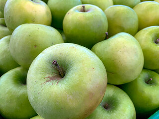 Ripe green apples in a supermarket