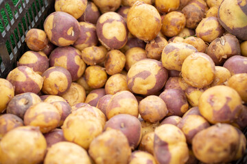 A view of a large pile of Laker Baker potatoes, on display at a local farmers market.
