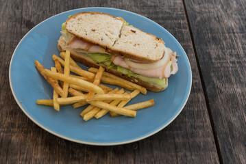 Roasted Pork Sandwich with french fries.