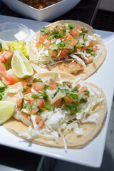 A view of a plate of fish tacos.