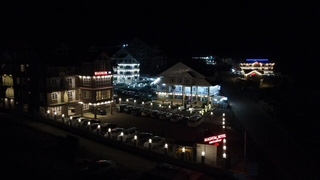 City at night with the hotel buildings illuminated with lights