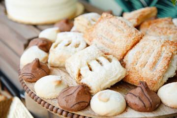 A view of a tray of assorted German pastries, featuring strudel.