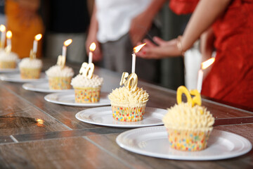 A view of a row of 50th birthday cupcakes on the table.