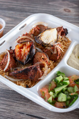 A view of a beef kebab plate.