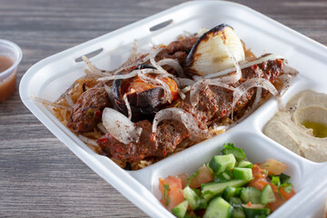 A view of a plate of Adana kebabs.
