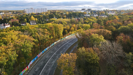 Fototapeta premium Top view of the road through the forest park in the city of Kharkov