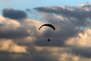 Paragliding in the sky over the Mediterranean Sea.
