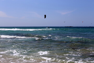 Paragliding in the sky over the Mediterranean Sea.