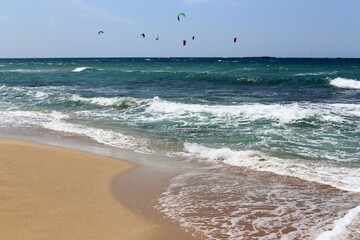 Paragliding in the sky over the Mediterranean Sea.