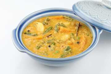 Kerala food -indian food spicy mixed vegetable curry Mix vegetable kurma - Indian recipe contains Carrots, cauliflower, green peas and beans, baby corn traditional
