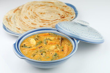 Malabar parotta with Kurma is a delicacy from the state of Kerala, Tamilnadu. Kurma is mixed veg south Indian curry with coconut milk.