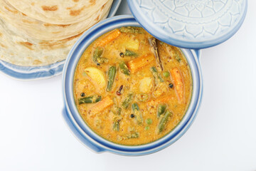 Malabar parotta with Kurma is a delicacy from the state of Kerala, tamilnadu. Kurma is mixed veg south Indian curry with coconut milk.