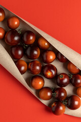 Black strawberry tomatoes in kraft paper.