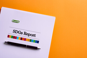 There is a dummy document of SDGs Report on the desk.