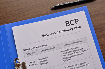 There is dummy documents that created for the photo shoot on the desk about Business Continuity...