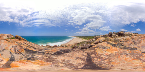 View from the cliff to a beautiful tropical beach and ocean. Elephant Rock, Arugam Bay, Sri Lanka. 360 panorama.