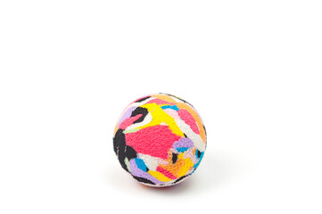 Multi-colored plastic ball with a soft fabric cover for playing with pets.
