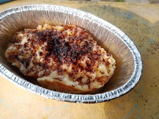 Homemade bread pudding made from white bread, eggs, milk, sugar and margarine by steaming