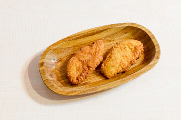 Fried Chicken breast hot crispy strips crunchy chicken tenders  isolated on white background.Nuggets isolated on white background on a plate