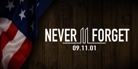 Fototapeta na wymiar 911 We will Never Forget text message with USA flag on wooden background