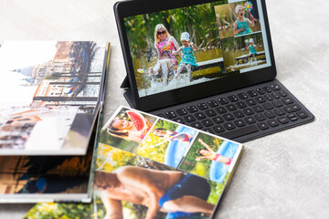 Fototapeta na wymiar photobook album and tablet on the table