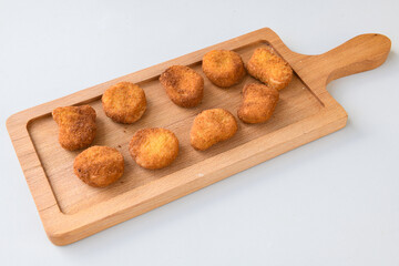 Fried Chicken breast hot crispy strips crunchy chicken tenders  isolated on white background.Nuggets isolated on white background on a plate