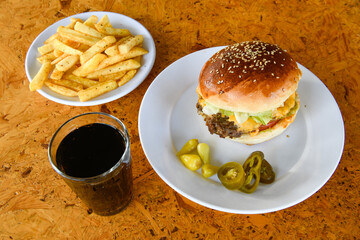 Big tasty burger with beef cutlet on a plate. Crispy chicken burger.