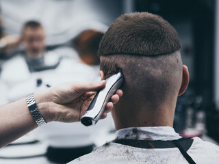 Barbershop haircut styling with hair clipper