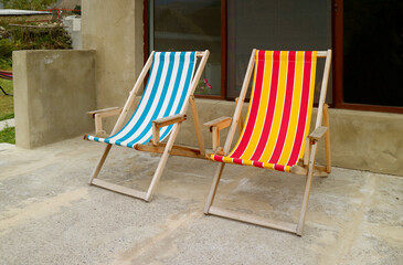Two of empty colorful deckchairs at the outdoor terrace