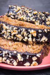 Pieces of zucchini dough with nuts and raisins