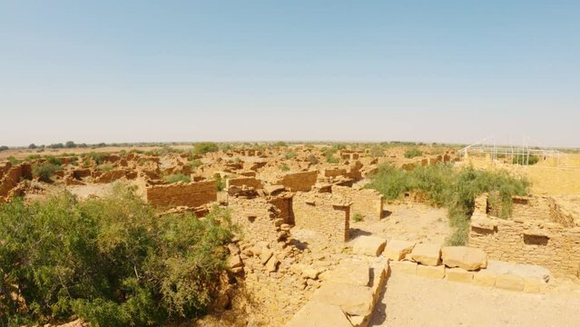 4K shot of the abandoned Kuldhara village near Jaisalmer, Rajasthan, India. Panning shot of old ruins of haunted Kuldhara village. Ruins of old village of old civilization.
