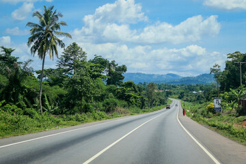 Fototapeta na wymiar Scenic African Road under the Blue Sky in Ghana, West Africa