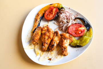 Chicken wings barbeque in a dish with BBQ grill sauce . Izgara tavuk kelebek sis kanat. Tavuk sis, gogus.
