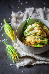 Ingredients for roasted zucchini flower as vegetarian snack.