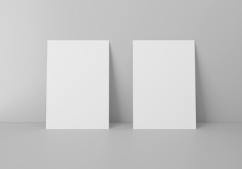 Empty 2 white vertical rectangle A4 paper sheet mockup on floor over grey wall, 3D rendering