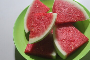 a few slices of watermelon on a plate