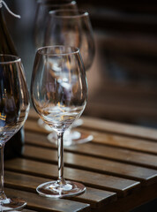 wine that is poured into glasses in the rays of the setting sun