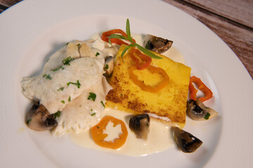 Recipe for sea bass fillet with fried polenta and white wine sauce. High quality photo