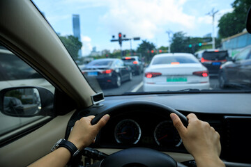 People driving car on city road