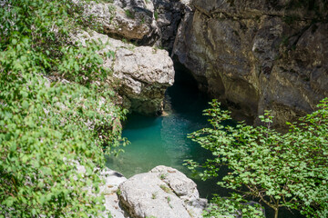 Fototapeta na wymiar an emerald coloured river winds through a rocky gorge, the Anisclo Canyon, Ordesa National Park, Aragon Spain
