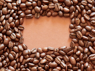 coffee beans. roasted coffee beans on brown background
