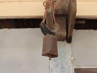 A small metal bell is to be attached to the animal's neck to sound off