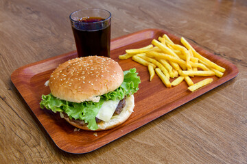 Big tasty burger with beef cutlet on a plate