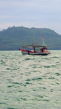 Vertical Video of a Khmer Fishing Boat Being Tossed in the Waves
