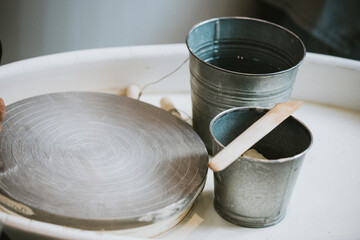 Cup and tools on pottery wheel