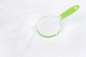 Laundry detergent for washing machines and a plastic scoop for dosing. Washing powder with...