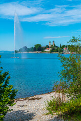 Germany, Friedrichshafen city marina at bodensee lake, houses and monastery in beautiful nature landscape in summer next to fountain in water © Simon