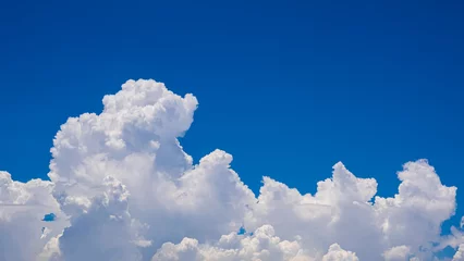Cloudscape background of beautiful white cumulonimbus clouds on blue sky in sunny day © Prapat